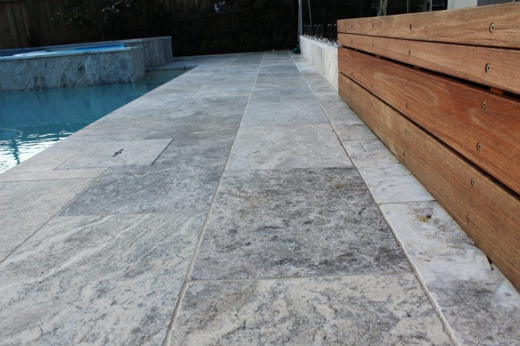 Silver Travertine stone pave as swimming pool flooring