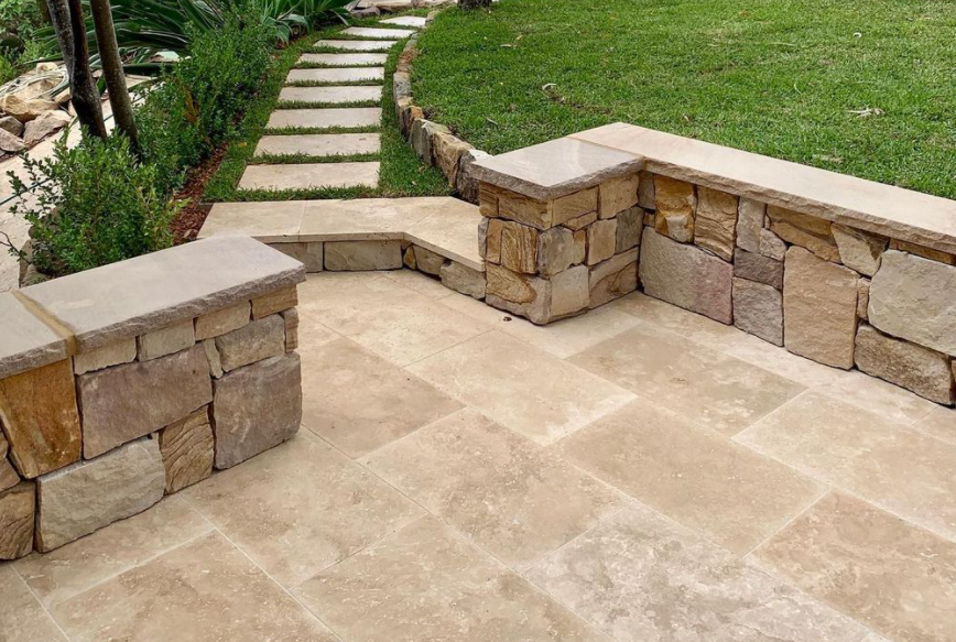 Ranch irregular Australian sandstone cladding and travertine paver in a residential project