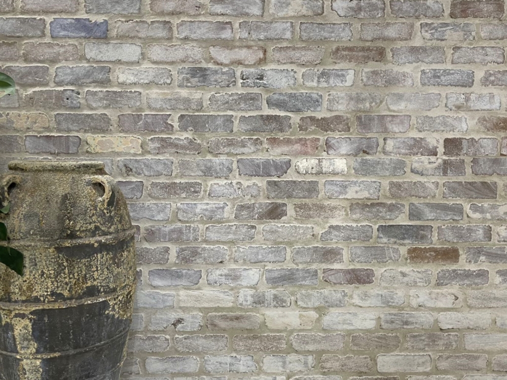 Sydney recycled dry pressed brick cladding with matching quoins. 35mm thick