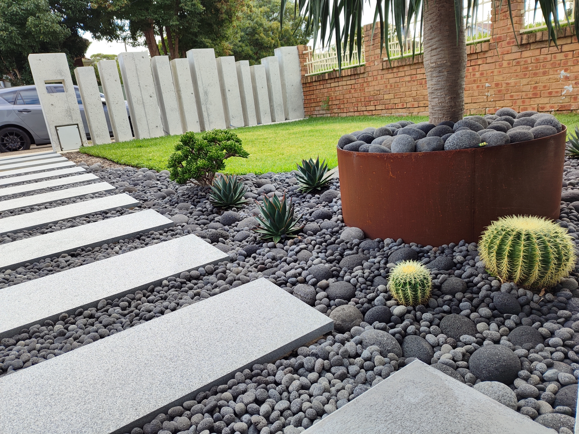 Lava Pebblestone landscaping and granite steppers