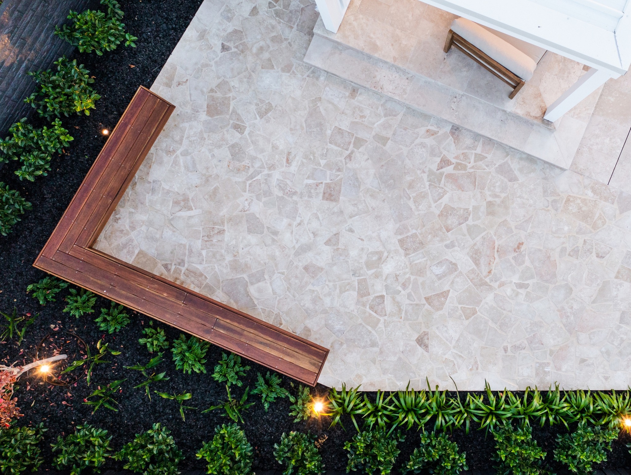 Classic travertine crazy paving and pool coping, landscaping project