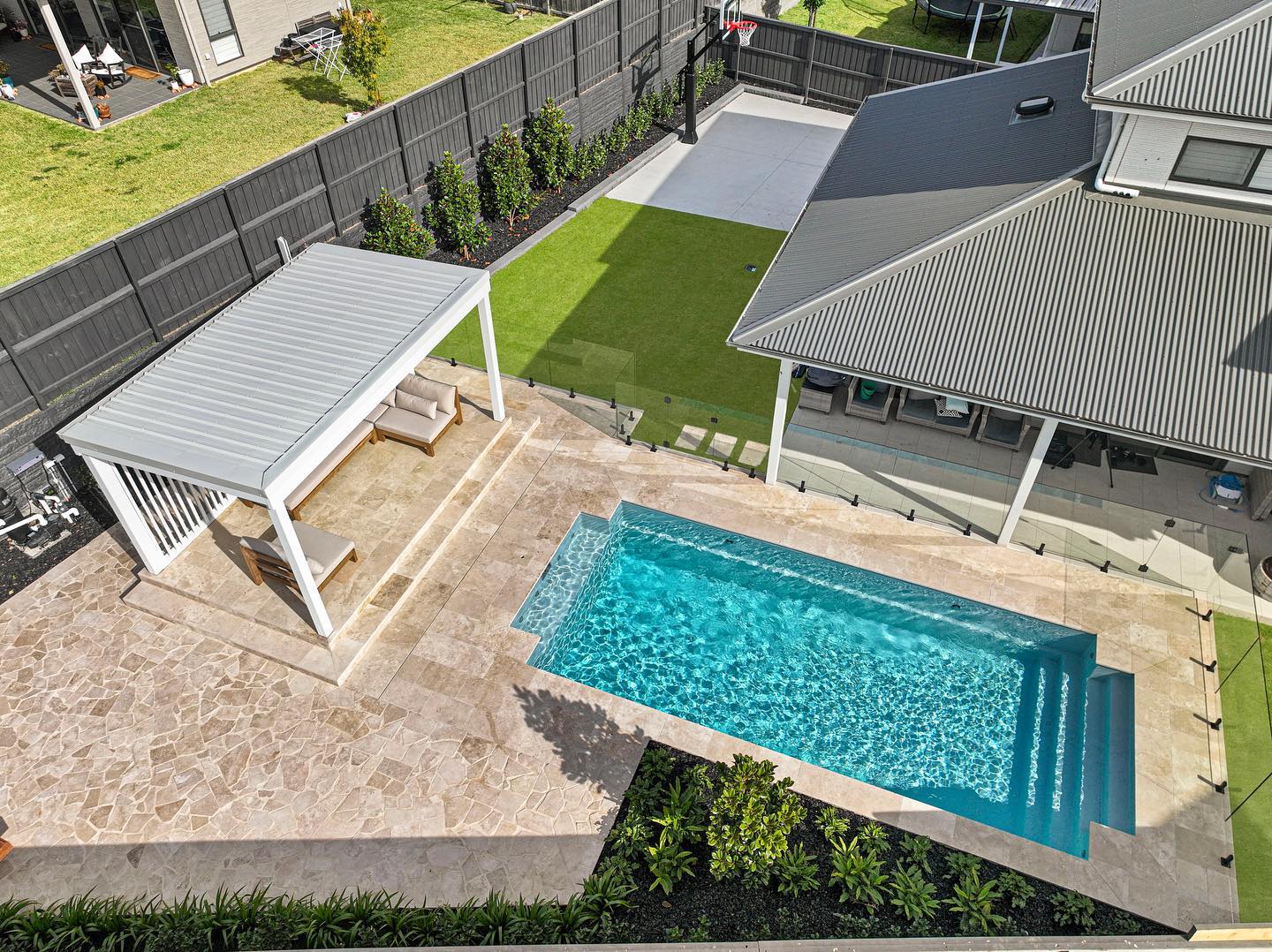 Classic Travertine paver and crazy paving pool Prestige Landscape & Construction at Gledswood Hills