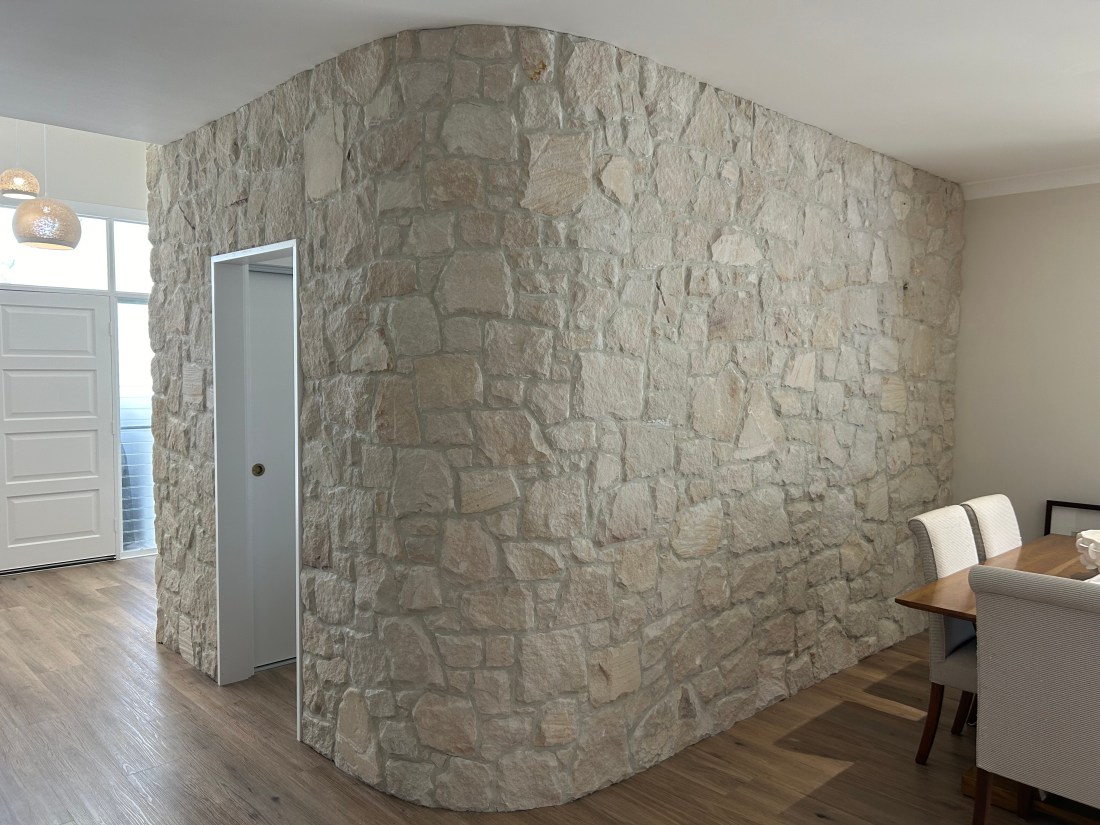 Foster irregular sandstone cladding curved wall
